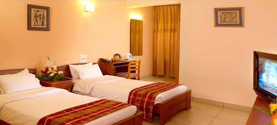 Twin-bed room at Mysore Mayflower Hotel