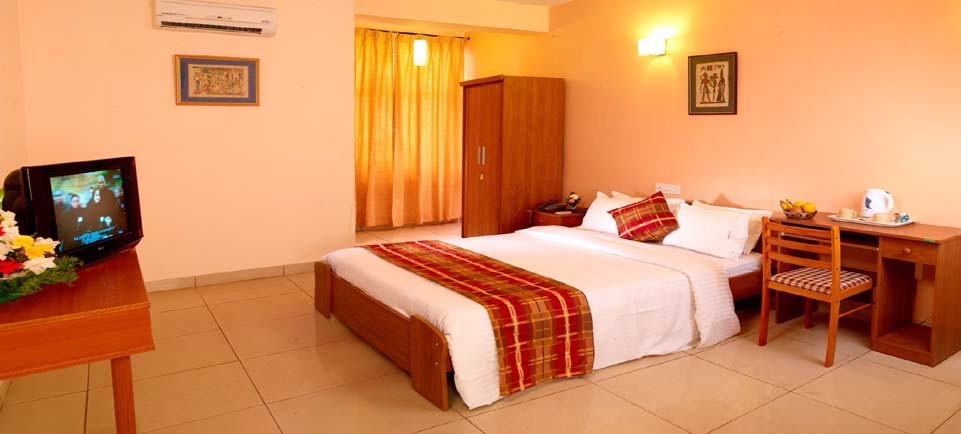 King-bed room at Mysore Mayflower Hotel